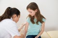 Doctor Injecting Syringe To Patient