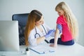 Doctor injecting vaccination in arm little child girl,healthy an Royalty Free Stock Photo