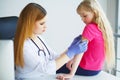 Doctor injecting vaccination in arm little child girl,healthy an Royalty Free Stock Photo