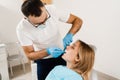 Doctor inserts impression tray and making cast of teeth to patient in dentistry before dental implantation. Procedure of Royalty Free Stock Photo