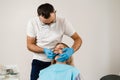 Doctor inserts impression tray and making cast of teeth to patient in dentistry before dental implantation. Procedure of Royalty Free Stock Photo