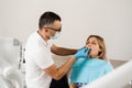 Doctor inserts impression tray and making cast of teeth to patient in dentistry before dental implantation. Procedure of Royalty Free Stock Photo