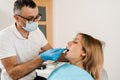 Doctor inserts impression tray and making cast of teeth to patient in dentistry before dental implantation. Procedure of Royalty Free Stock Photo