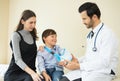 Doctor inspecting broken hand of little patient.Mother holding b Royalty Free Stock Photo