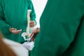 doctor joins a meeting with the surgeon's team to discuss a plan for cancer surgery after the medical team detects cancer.