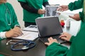 doctor joins a meeting with the surgeon's team to discuss a plan for cancer surgery after the medical team detects cancer.