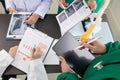 doctor joins a meeting with the surgeon's team to discuss a plan for cancer surgery after the medical team detects cancer.