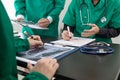 doctor joins a meeting with the surgeon's team to discuss a plan for cancer surgery after the medical team detects cancer.