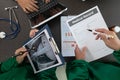 doctor joins a meeting with the surgeon's team to discuss a plan for cancer surgery after the medical team detects cancer.