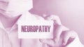 Doctor keeps a card with the name of the diagnosis - neuropathy. Medical concept