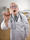 Doctor in lab coat using tongue depressor