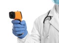 Doctor in latex gloves holding non contact infrared thermometer on background, closeup. Measuring temperature