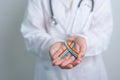 Doctor with LGBTQ Rainbow ribbon for Support Lesbian, Gay, Bisexual, Transgender and Queer community and happy Pride month concept