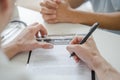 Doctor listening patient explain his symptom and notes to medical record Royalty Free Stock Photo