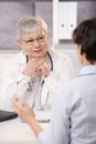 Doctor listening to patient