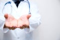 Doctor lman hand with something. Royalty Free Stock Photo