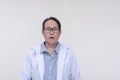 A doctor looking baffled and shocked, mouth wide open. Of asian descent, middle aged male. Isolated on a white background