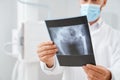 Doctor looking of scan with result after ultrasound of pelvis. Royalty Free Stock Photo