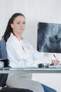 Doctor looking at x-ray picture hand Royalty Free Stock Photo