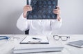 Doctor looking at xray picture of head Royalty Free Stock Photo