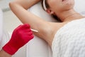Doctor makes injections of botulinum toxin in the underarm area against hyperhidrosis in beauty salon. Female Royalty Free Stock Photo