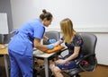 Doctor makes the patient an injection into a vein Royalty Free Stock Photo