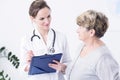 Doctor making the anamnesis with elder woman Royalty Free Stock Photo