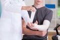Doctor making cast of upper limb Royalty Free Stock Photo