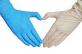 Doctor making heart shape with hands in different medical gloves Royalty Free Stock Photo