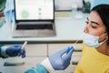 Doctor making swab nasal test to young woman in medical clinic for coronavirus infection - Focus on girl eye Royalty Free Stock Photo