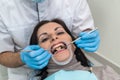 Doctor making treatment procedures in dentistry close up