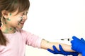 Doctor making vaccination injection to an afraid child girl sick with chickenpox, measles or rubella virus. Vaccination of