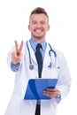 Doctor making the victory sign Royalty Free Stock Photo