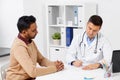 Doctor and male patient meeting at clinic