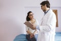 Doctor male talking to patient female at the Doctors consult. Medical concept Royalty Free Stock Photo