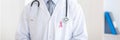 Doctor man with breast cancer awareness ribbon Royalty Free Stock Photo