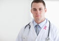 Doctor man with breast cancer awareness ribbon Royalty Free Stock Photo