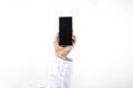 Doctor man hand holding a smartphone with black screen isolated on a white background Royalty Free Stock Photo