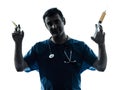 Doctor man holding hypodermic syringe silhouette Royalty Free Stock Photo