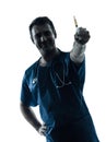 Doctor man holding hypodermic syringe silhouette portrait Royalty Free Stock Photo