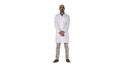 Doctor man is a little bit nervous and scared standing on white background. Royalty Free Stock Photo