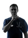 Doctor man surgeon hushing portrait silhouette Royalty Free Stock Photo