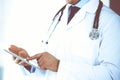 Doctor man using tablet computer for network research or virtual disease treatment, hands close-up. Perfect medical Royalty Free Stock Photo