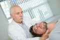 Doctor manipulating patient`s neck Royalty Free Stock Photo