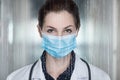 Doctor in a mask on a background of binary codes