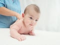 Doctor massage small caucasian baby