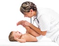 Doctor massaging or doing gymnastics smiling baby Royalty Free Stock Photo