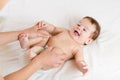 Doctor massaging infant baby Royalty Free Stock Photo