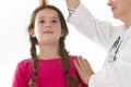 Doctor measurement the girl stature Royalty Free Stock Photo