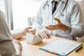 Doctor Measuring arterial blood pressure with man patient on arm Health care in hospital Royalty Free Stock Photo